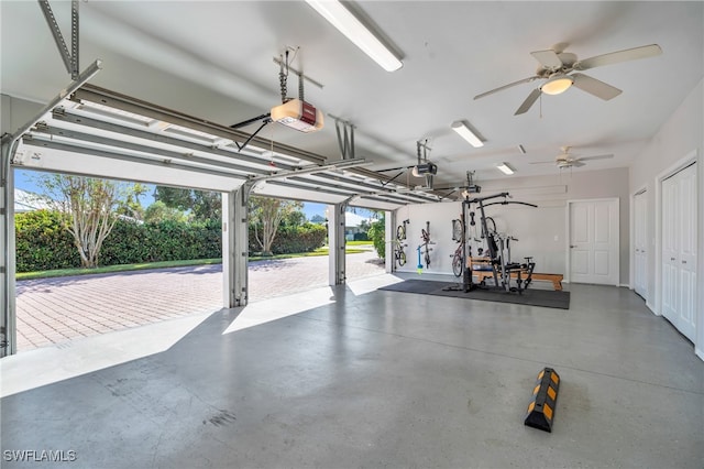 garage featuring ceiling fan and a garage door opener