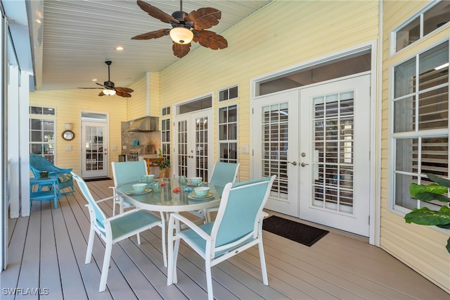 wooden deck featuring french doors and ceiling fan