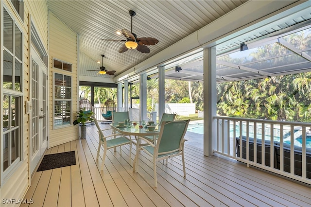 exterior space featuring ceiling fan and lofted ceiling