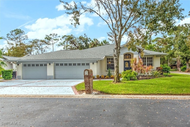 ranch-style home with a front lawn and a garage