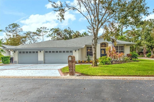 15600 Willow Oak Ct, Fort Myers, FL 33912 - ranch-style house featuring an attached garage, stucco siding, concrete driveway, and a front yard