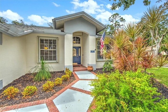 15600 Willow Oak Ct, Fort Myers, FL 33912 - view of exterior entry with stucco siding