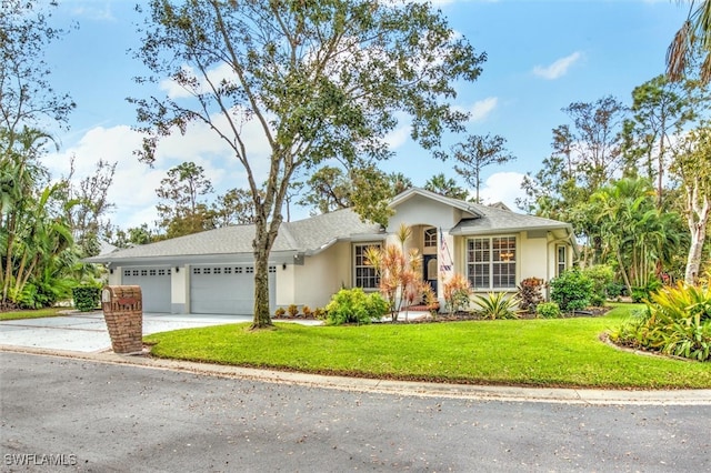 ranch-style home featuring a garage and a front lawn