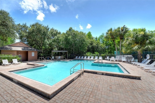 view of swimming pool featuring a patio area