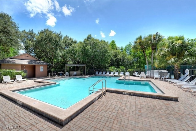 15600 Willow Oak Ct, Fort Myers, FL 33912 - community pool with fence, a patio, and view of scattered trees