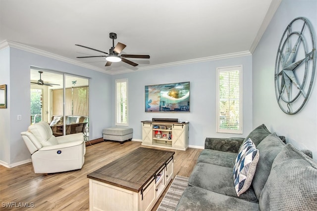 living room with light hardwood / wood-style flooring, ornamental molding, and ceiling fan