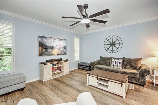 15600 Willow Oak Ct, Fort Myers, FL 33912 - living area featuring light wood-style floors, ornamental molding, healthy amount of natural light, a ceiling fan, and baseboards