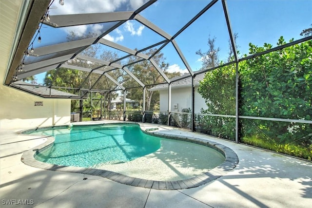 15600 Willow Oak Ct, Fort Myers, FL 33912 - swimming pool featuring a patio and glass enclosure