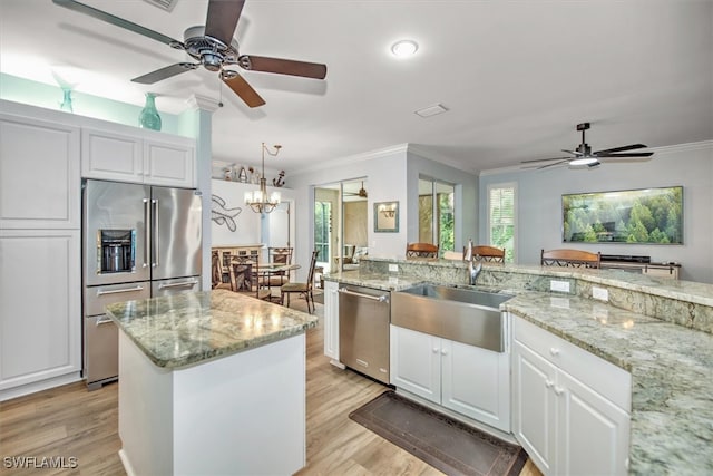 kitchen featuring light hardwood / wood-style flooring, white cabinetry, stainless steel appliances, and sink