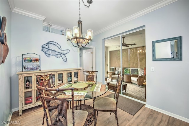 dining room featuring ornamental molding, a chandelier, and light hardwood / wood-style flooring