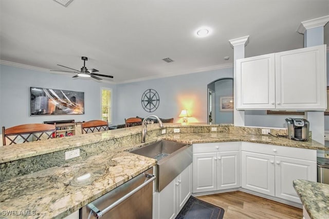 15600 Willow Oak Ct, Fort Myers, FL 33912 - kitchen with a sink, dishwasher, light stone counters, light wood-style flooring, and ornamental molding