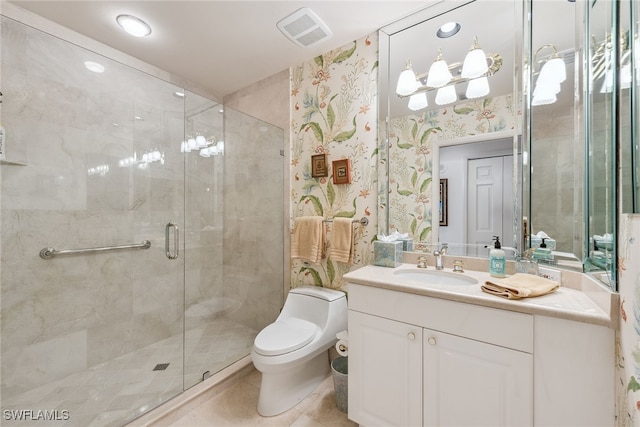 bathroom featuring tile patterned floors, vanity, toilet, and walk in shower