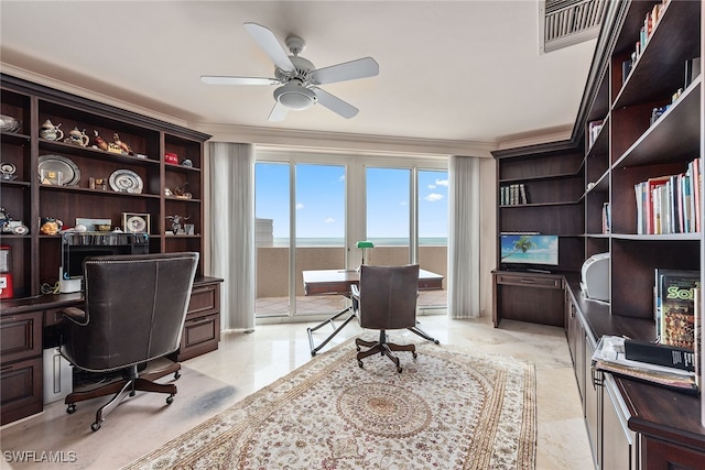 office area with ceiling fan and ornamental molding