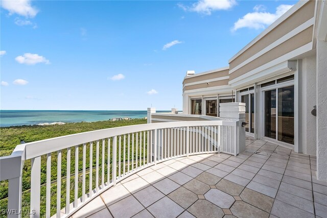 balcony featuring a water view