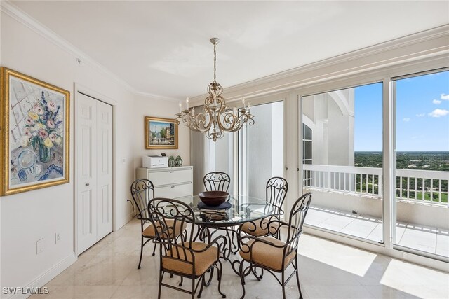 dining area featuring ornamental molding and a notable chandelier