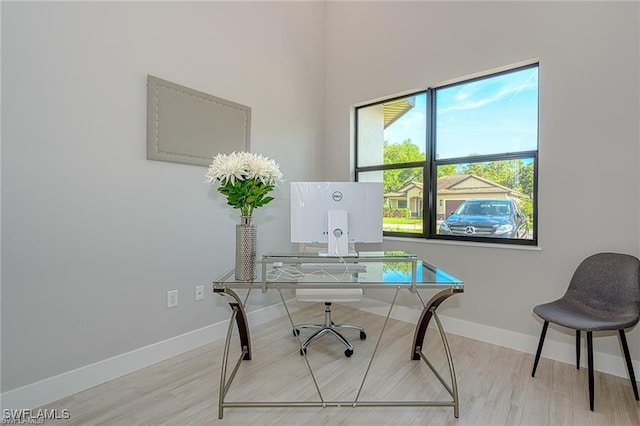 office space with light wood-type flooring