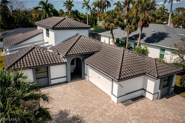 mediterranean / spanish-style house featuring a garage