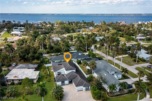 birds eye view of property with a water view