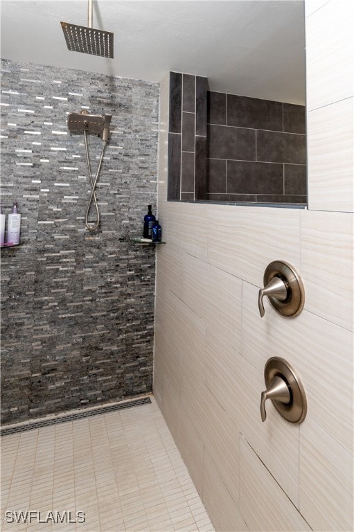 bathroom featuring a shower and tile walls