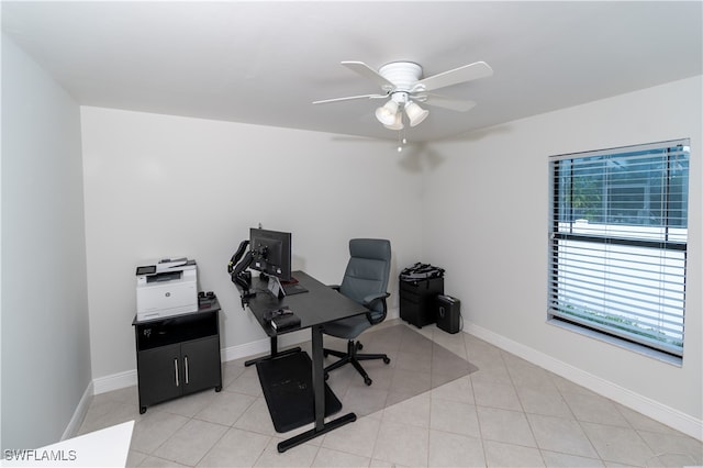 tiled office space featuring ceiling fan