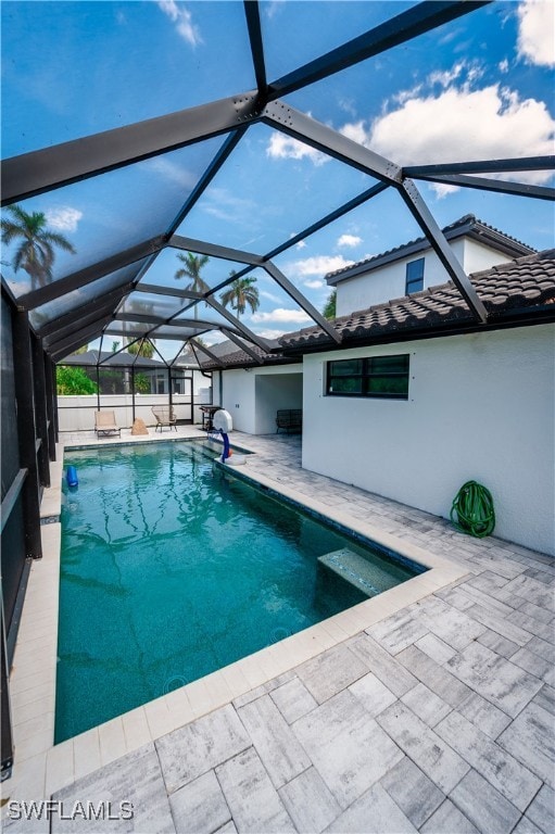 view of pool featuring a patio and a lanai