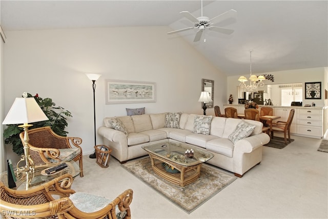 living room featuring ceiling fan with notable chandelier, light colored carpet, and high vaulted ceiling