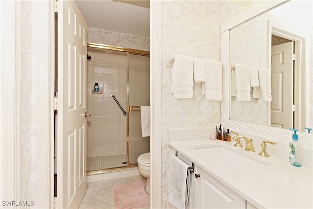 bathroom with walk in shower, tile patterned floors, toilet, and vanity