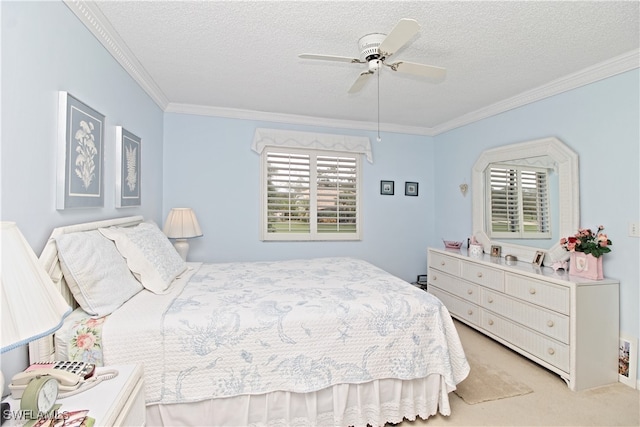 bedroom with ceiling fan, crown molding, light colored carpet, and a textured ceiling