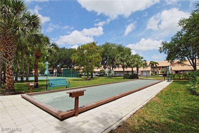 view of property's community featuring a yard