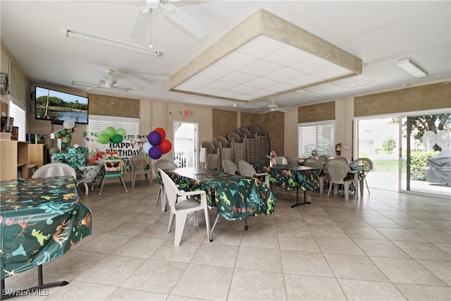 dining space featuring ceiling fan and light tile patterned floors