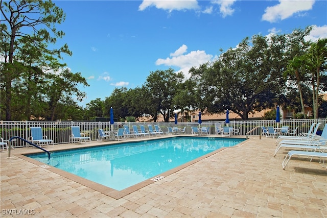 view of pool featuring a patio