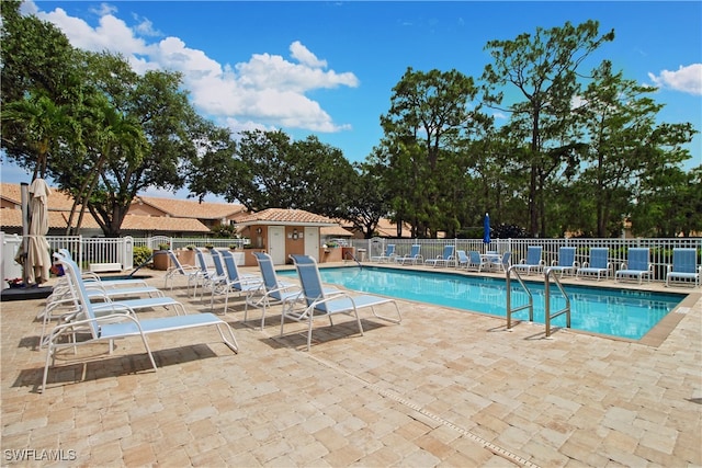 view of pool featuring a patio