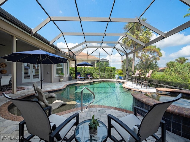 view of swimming pool featuring french doors, a patio area, and glass enclosure