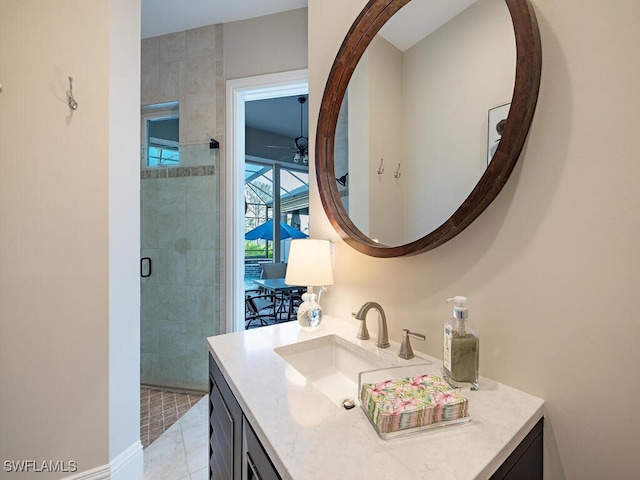 bathroom with vanity, tile patterned floors, and walk in shower