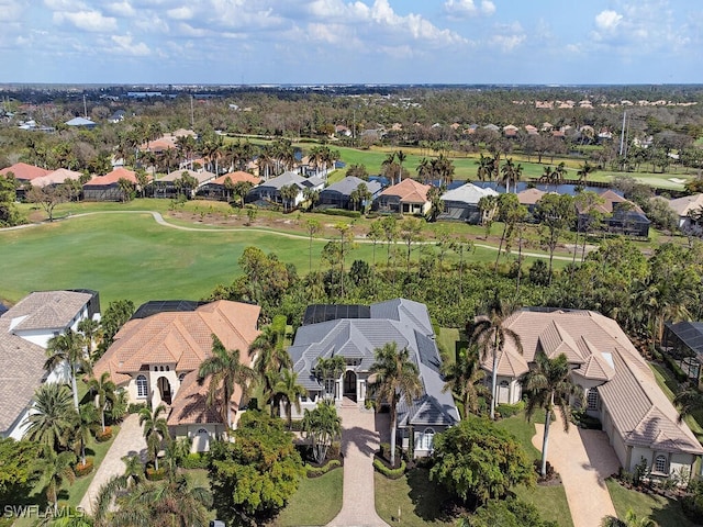 aerial view with a residential view and view of golf course