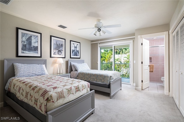 bedroom featuring ensuite bath, ceiling fan, access to exterior, light colored carpet, and a closet