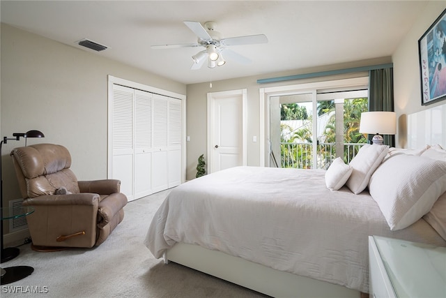 carpeted bedroom featuring access to outside, ceiling fan, and a closet