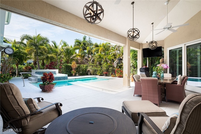 view of pool featuring an in ground hot tub, ceiling fan, a patio, and an outdoor hangout area