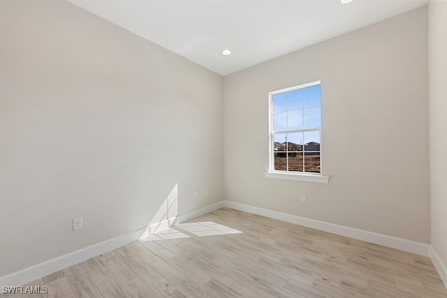 spare room featuring light hardwood / wood-style floors