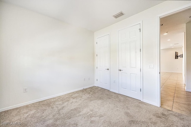 unfurnished bedroom with carpet