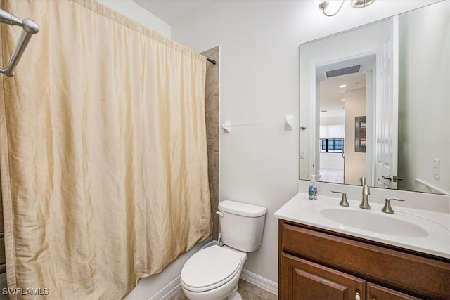 full bathroom featuring shower / tub combo, vanity, and toilet