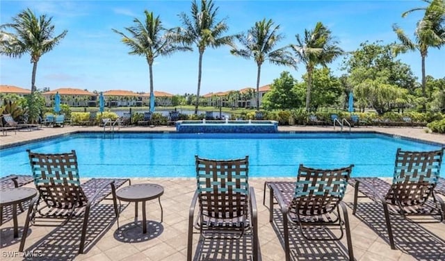 view of pool with pool water feature