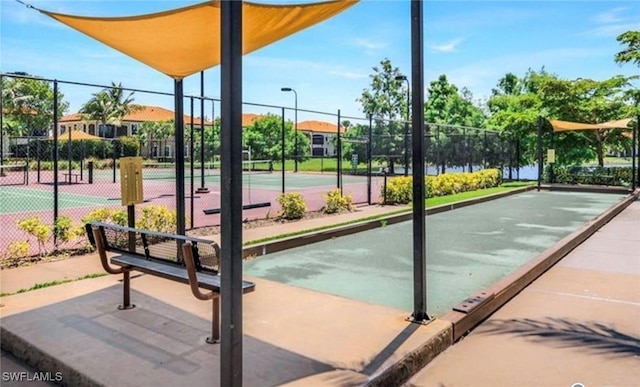 surrounding community featuring tennis court