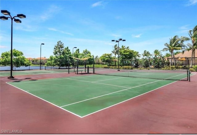 view of tennis court featuring basketball court