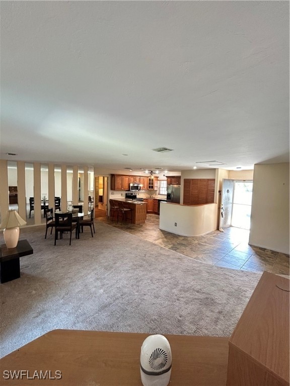 unfurnished living room with light carpet