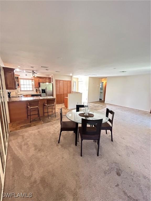 4301 Island Cir Unit 2, Fort Myers, FL 33919 - dining area with light colored carpet