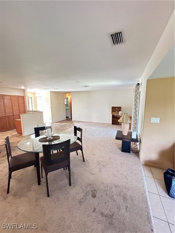 dining area with light tile patterned floors