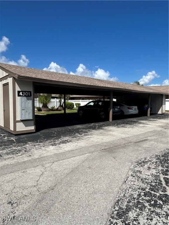 view of parking with a carport