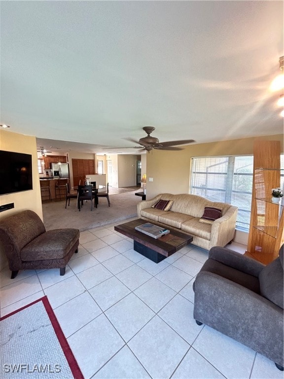 living room with light tile patterned flooring and ceiling fan