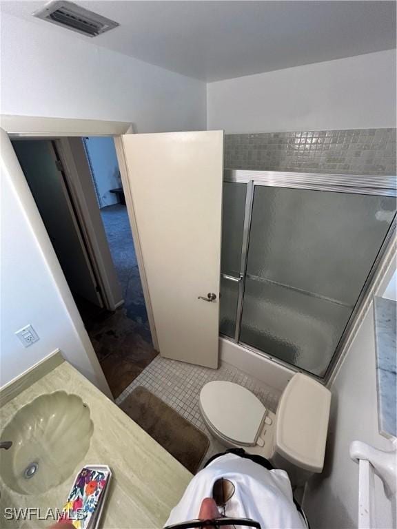 4301 Island Cir Unit 2, Fort Myers, FL 33919 - full bath featuring toilet, a shower with door, and tile patterned flooring